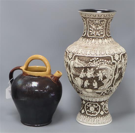 A modern Chinese large baluster vase carved in low relief with scenes on a brown ground and a treacle-glazed pottery vessel vase 46cm